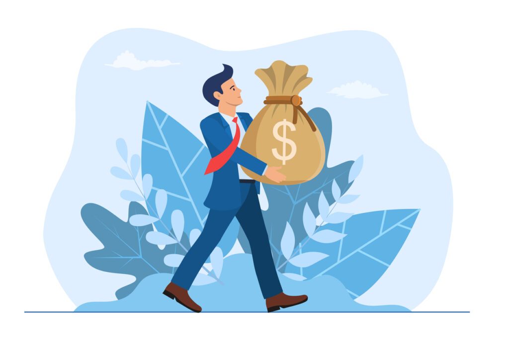 Businessman holding large bag full of money
