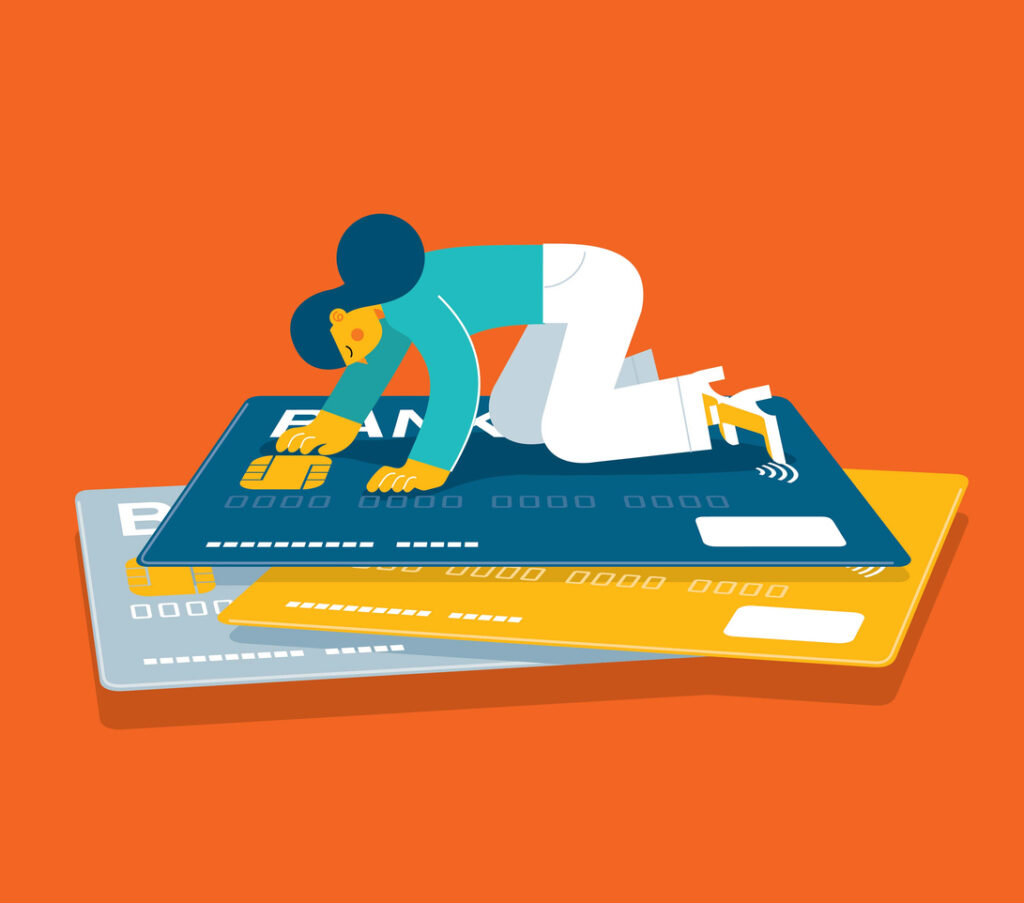 Woman on top of a stack of credit cards