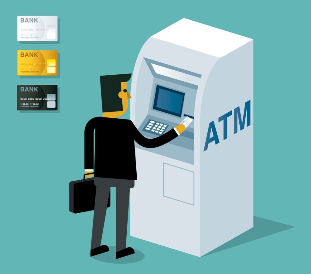 A man taking money out of an ATM